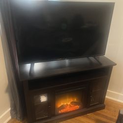 Wooden Fireplace & 55” TV