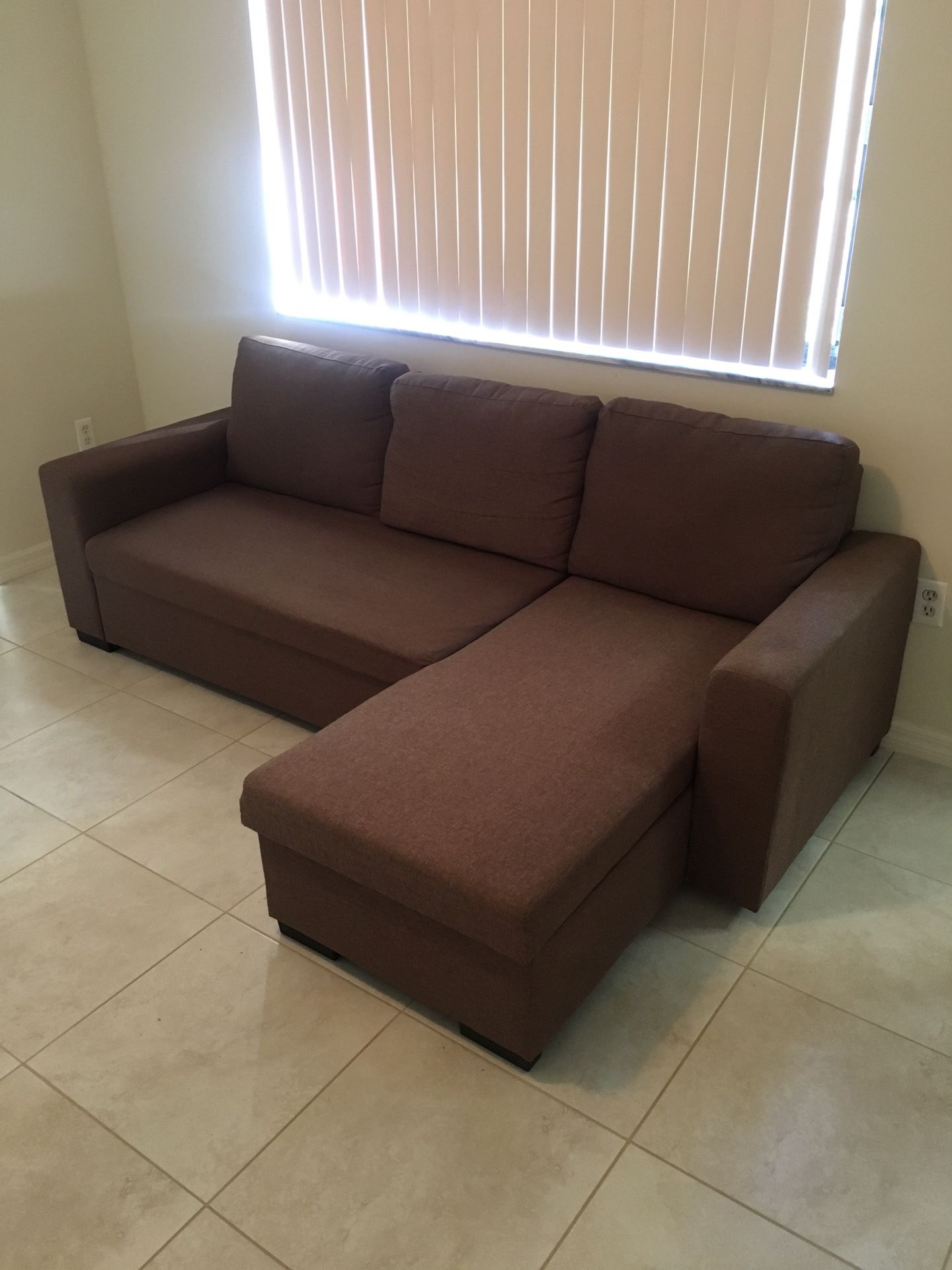 Sectional sofa with pull-out bed and compartment
