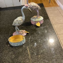 They open up like a box with a magnet and their storks and you can give them his gifts for baby gifts and they're out of metal hand-painted with eston