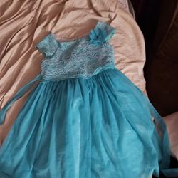 Teal Dress With a Teal Flower On It