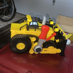 Tonka truck with handle to push plow