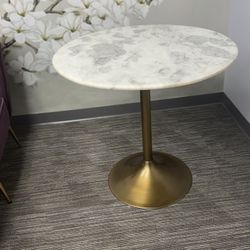 Modern, elegant pedestal side table with a clean, upscale look  