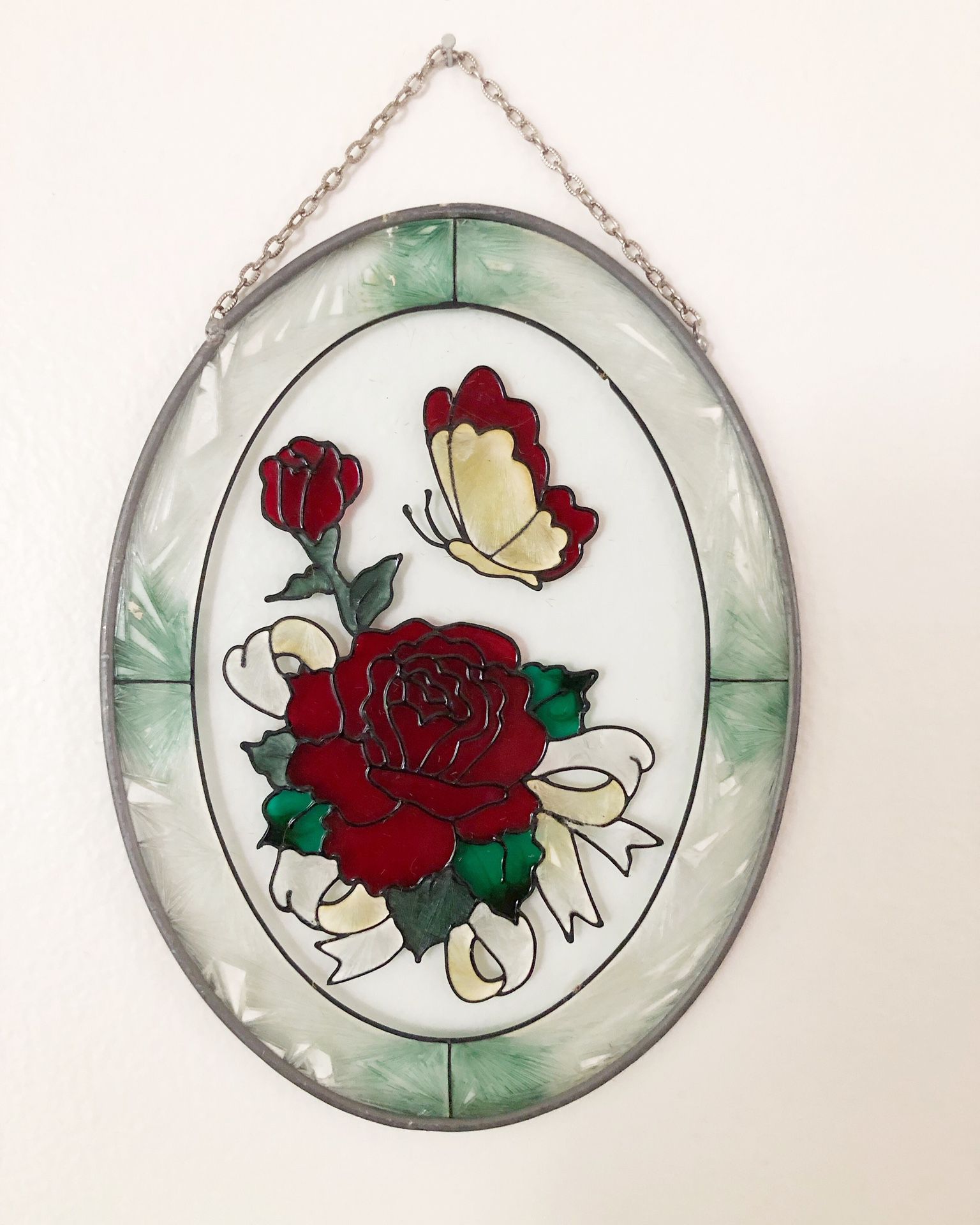 Vintage oval stained glass hanging with red roses and butterfly
