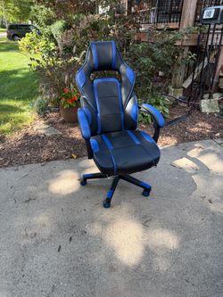 Black and blue racing-style gaming/office chair, swivels, adjustable, recliner, like new, $50