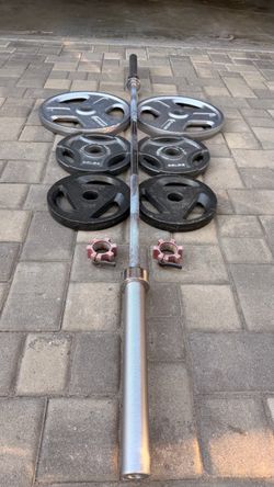 Olympic weights and 7 foot Barbell and lock collars