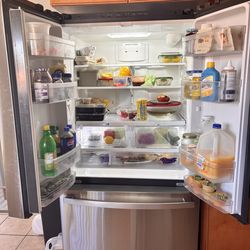 GE counter-depth 21.9 - cu ft 3-door 36 inch wide French door refrigerator with water dispenser