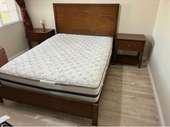 Queen bed with two nightstands