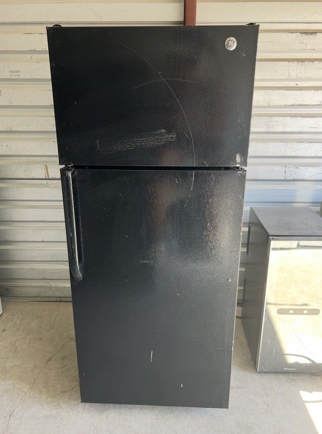 Black GE Refrigerator And Freezer