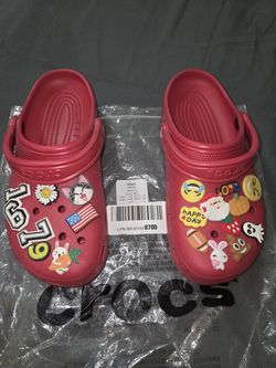 Red crocs with charms size 10 Womens 8 mens good condition
