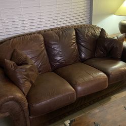 Nice Leather Couch, Love Seat And Over Sized Chair With Ottoman.  Good Condition, End Table, Lamp  And Rug Included