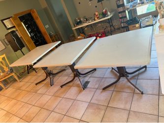 Three matching adjustable space tables