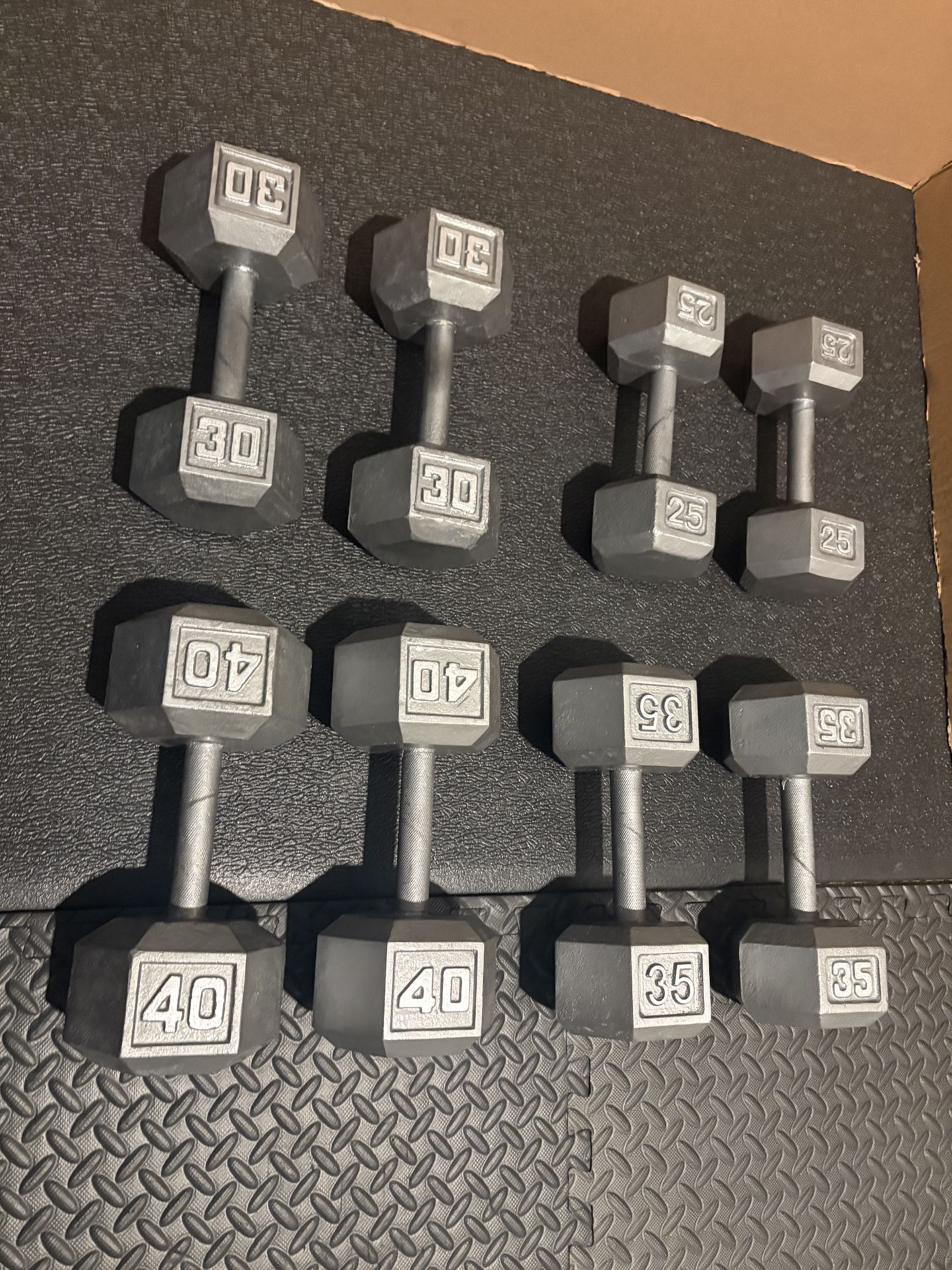 Set of Hex Cast Iron Dumbbells heavy) 40#, 35#, 30 and 25 In