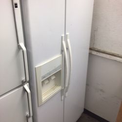 #13 Used White Whirlpool Side By Side Refrigerator 