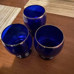 cobalt blue glasses with silver rims 