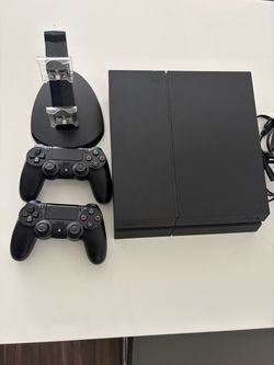 Sony PlayStation 4 Console with Two Controllers