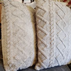 Medium gray pillow  lot with raised ridges.