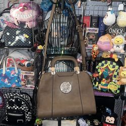 Gorgeous, brown leather shoulder bag, clean inside and out with gold medal designs. Detachable Crossbody strap also adjust.