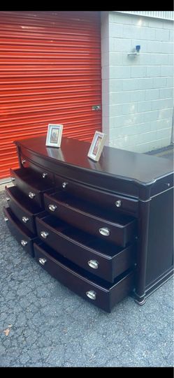 Delivery available. Solid Wood black long dresser with big drawers. Drawers sliding smoothly