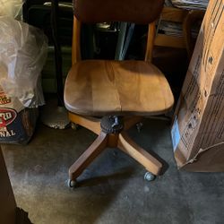 Antique desk chair with castor wheels