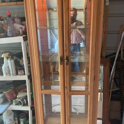 Lighted display cabinet it’s 77 inches tall 28 inches wide and 10 inches wide 