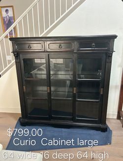 Large Dark Wood Curio Cabinet with Glass Doors We are located at 2811 East Bell road. Another Time Around Furniture.
