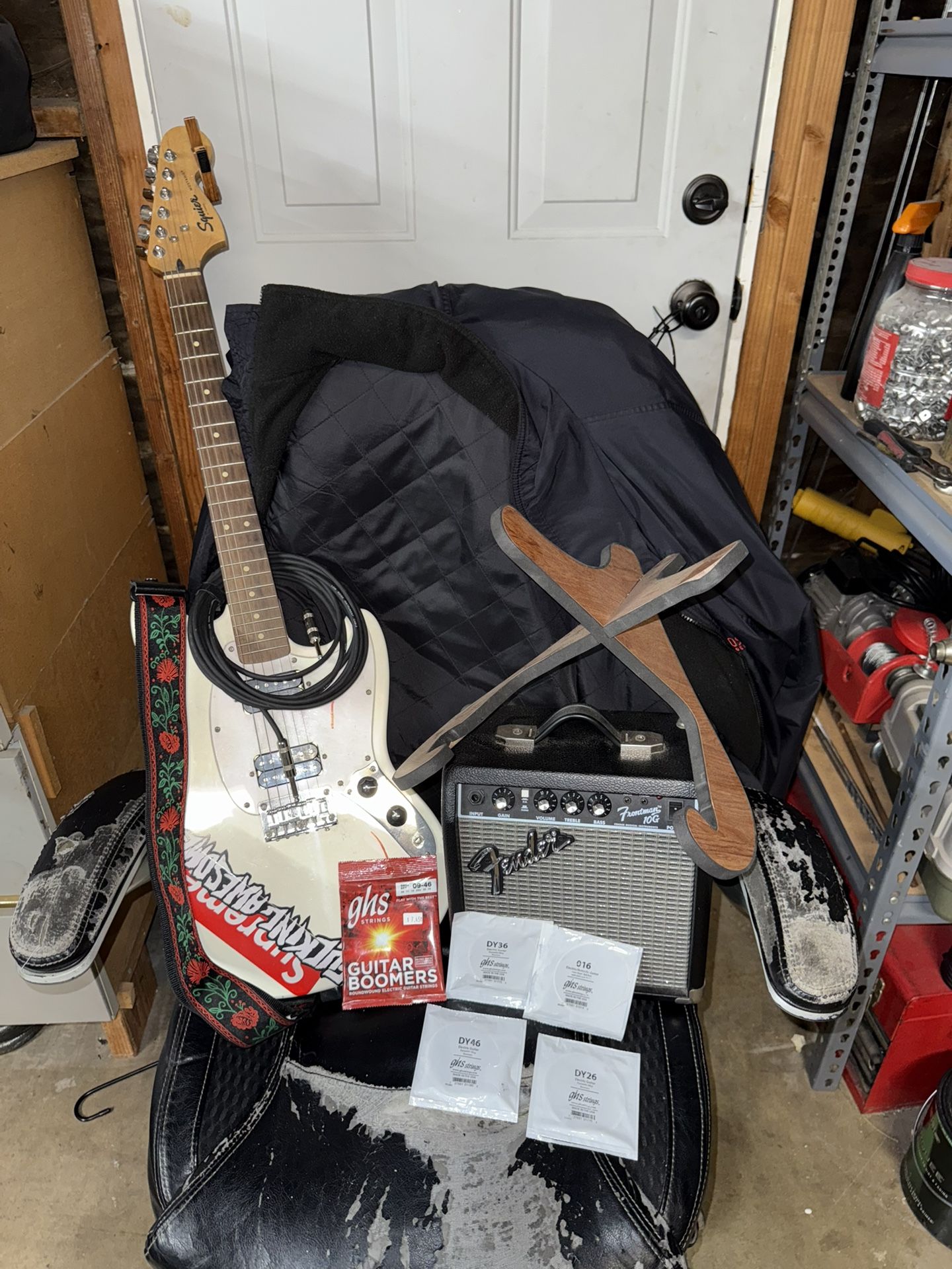 electric guitar bundle with amp, strap, stand, and long wire