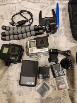 2 gopros with attachments,