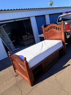 Twin bed has two drawers and storage space mattress included