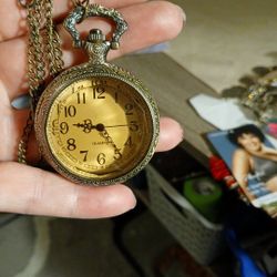 The antique pocket clock is working. 