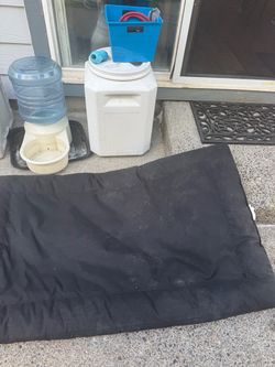 Large dog Matt and food container and water dish