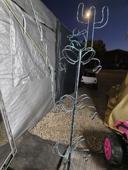 Man sleeping buy cactus medal wine rack.