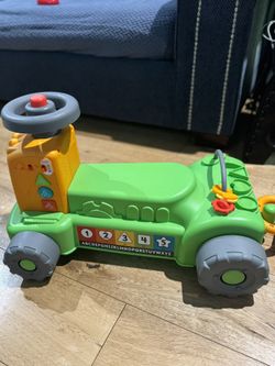Fisher-Price Baby to Toddler Toy Laugh & Learn 4-in-1 Farm to Market Tractor Ride On with Pull Wagon