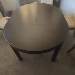 IKEA Extendable Dining Table With Four Chairs. 
