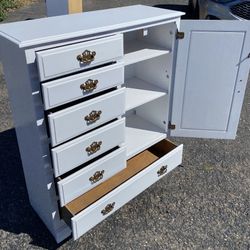 Dresser with cabinet white Five drawers on the left side, a cabinet with three shelves, and then a big drawer on the bottom which slides easily on a c
