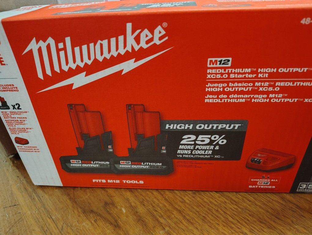 Milwaukee Two 5.0ah High Output Batteries And Charger