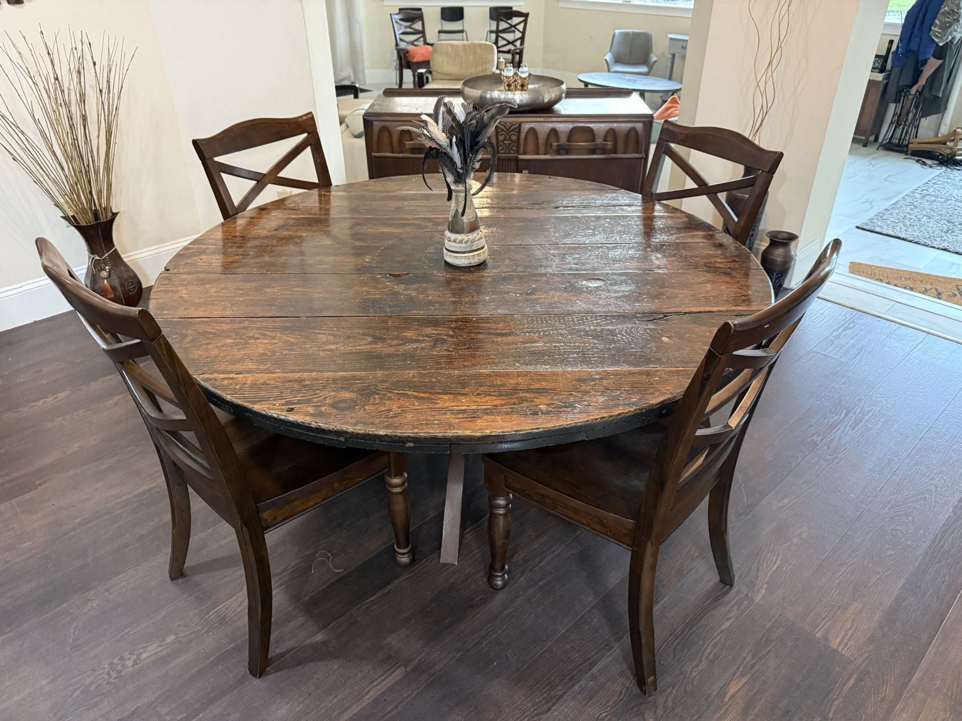 solid-wood dining table with four matching chairs and sideboard buffet