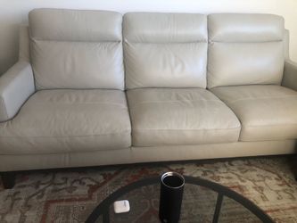 Cream leather sofa with two fabric chairs