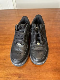 Nike Air Force 1 black leather trainers