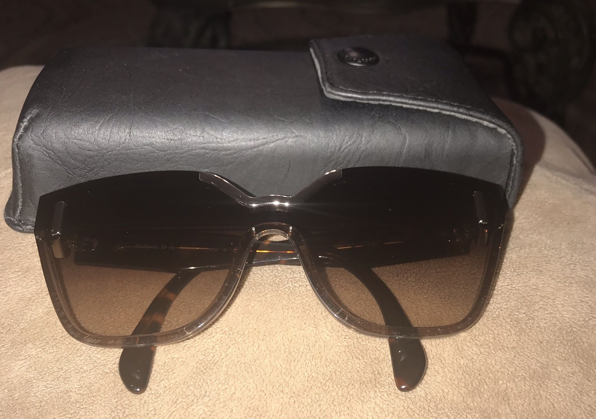 Original Prada ladies sunglasses with case.New never used