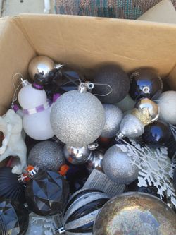 Box full of raiders color christmas ortaiments and lights $20