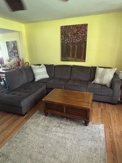 . Charcoal grey sectional couch.