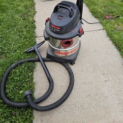 SHOP VAC 5HP , 5 GAL WET AND DRY VAC/VACCUM  WITH ATTACHMENT,  STAINLESS STEEL, EXCELLENT CONDITION 