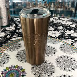 Starbucks Travel Cup. Gold ColoredEmbossed Mermaid Symbol.