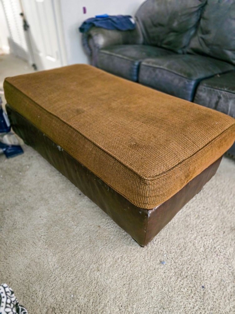 Brown Fabric Ottomon w/darker brown Leather base Xtra Long Good Condition minor expected wear and tear
