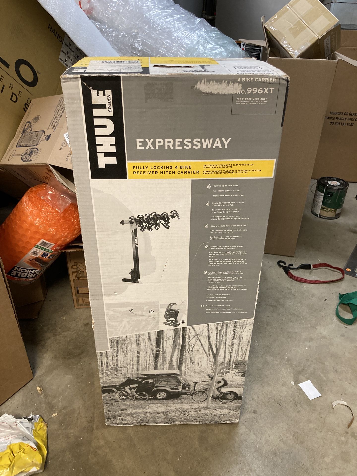 Thule Expressway 4 Bike Rack New In Box.  4 bikes, locks to receiver included, bike arm folds down when not in use, integrated locking cable stores in