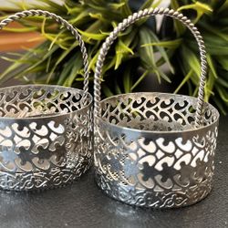 Add a touch of elegance to your home with these intricately designed candle holders. Perfect for creating a warm and inviting atmosphere.