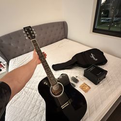 Guitar with amplifier and full set of new strings
