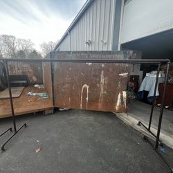 2 Vintage industrial cloth racks 10 ft long