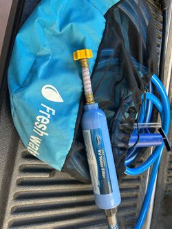 RV travel trailer hose with filter with storage bag, black/grey drain hose w/storage bag, and drainage attachment for back pressure rinse.