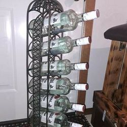 Metal wine holder. Holds 7 bottles. Floor or tabletop